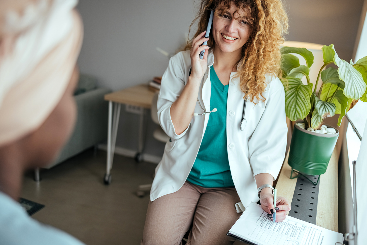 Woman with cancer meeting with female physician