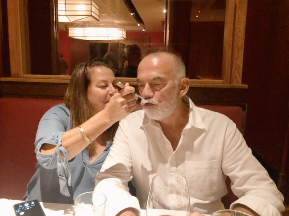 Woman feeding a man with a fork